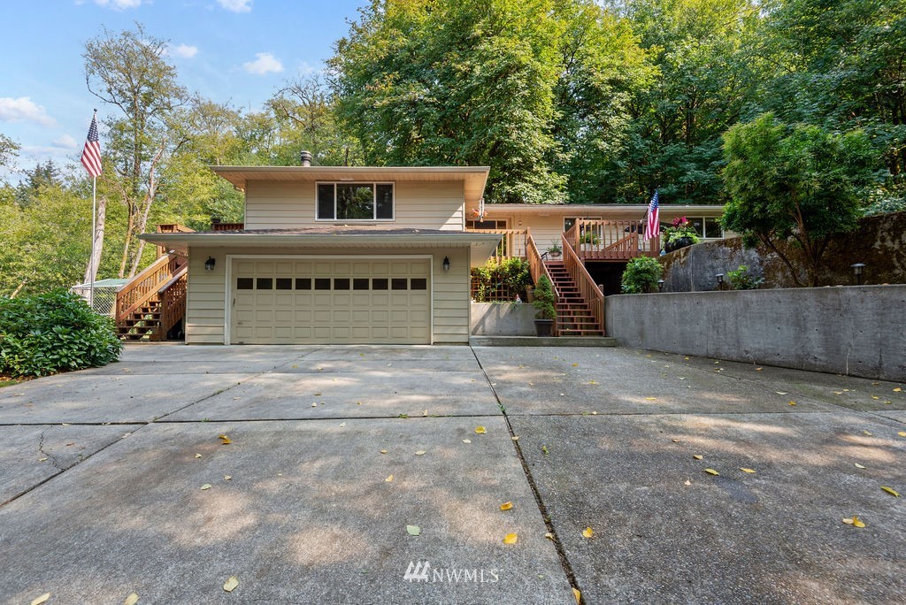 755 Hazel Dell Road Castle Rock, WA 98611 - Photo 24 of 30 a view of a house with a wooden fence