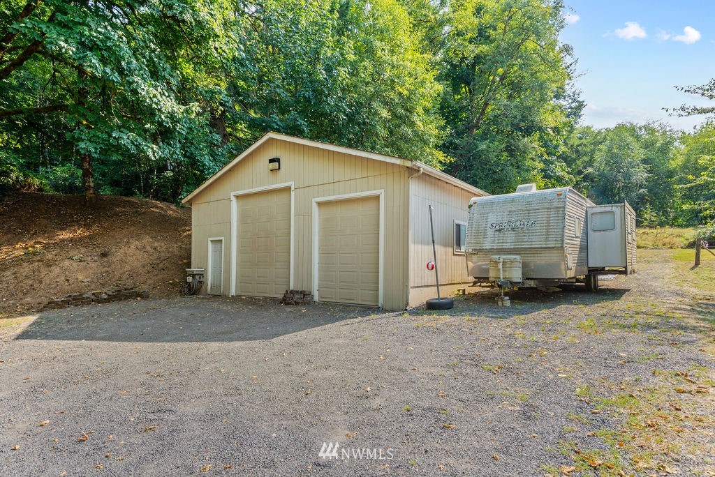 755 Hazel Dell Road Castle Rock, WA 98611 - Photo 27 of 30 a view of a house with a backyard