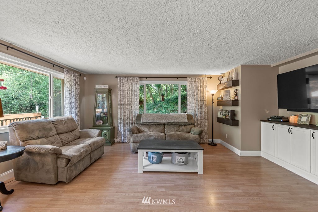 755 Hazel Dell Road Castle Rock, WA 98611 - Photo 10 of 30 a living room with furniture and a flat screen tv