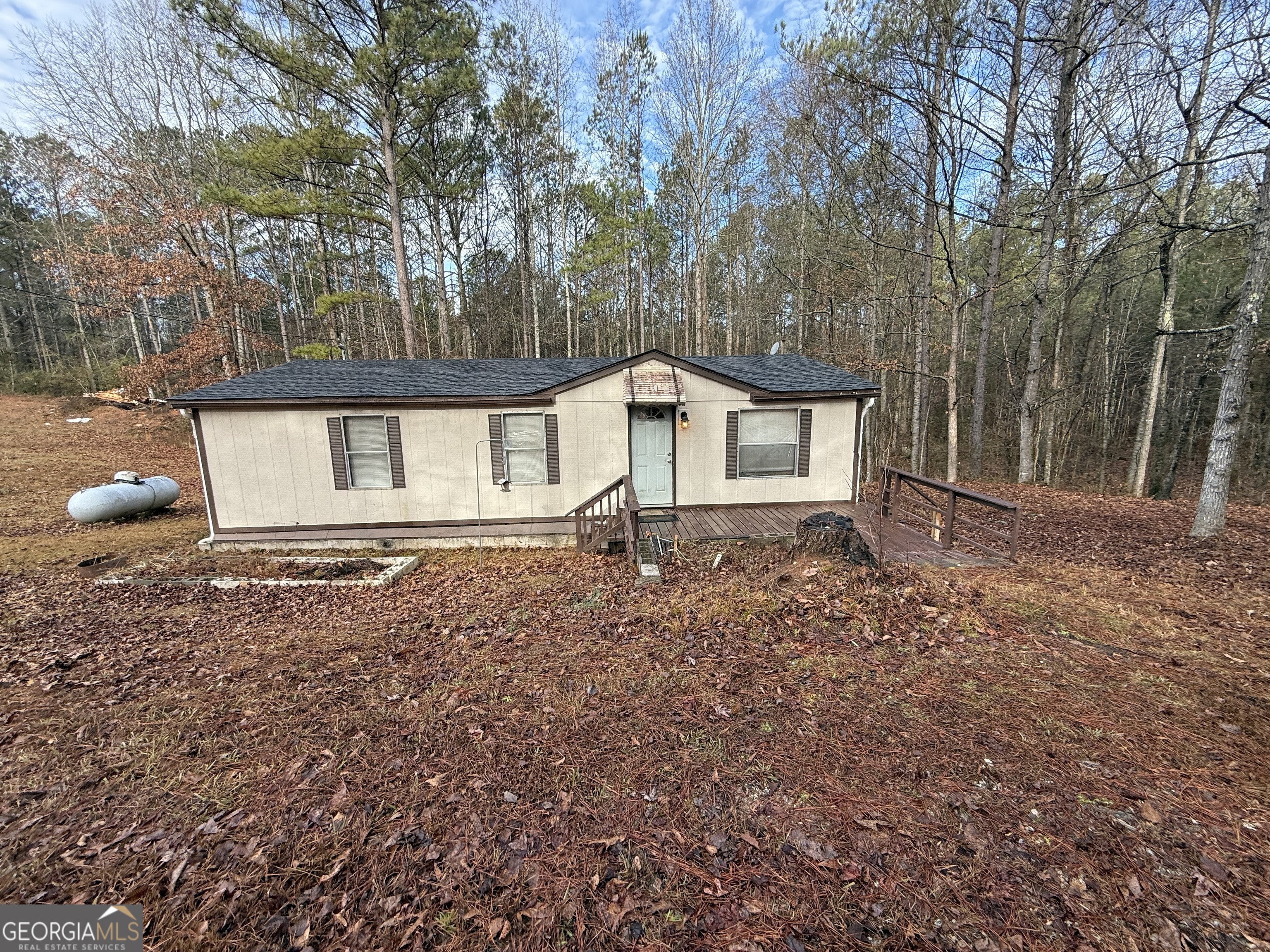 688 Mt Zion Road Franklin, GA 30217 - Photo 1 of 1 a house with trees in front of it