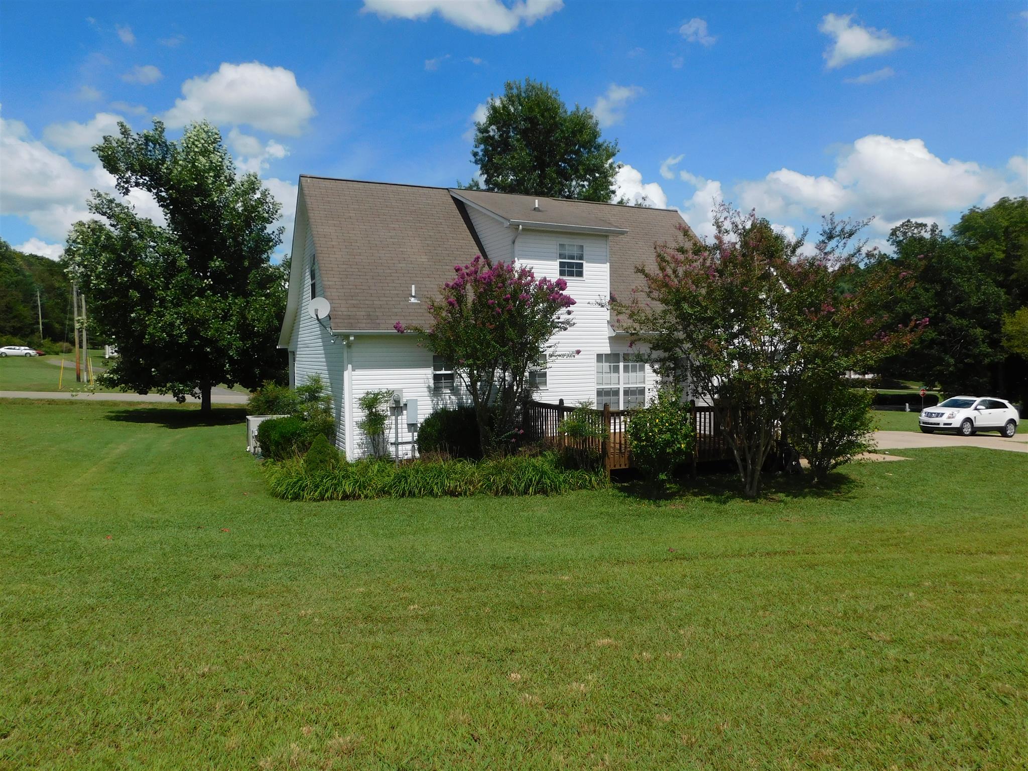 4368 Scott Hollow Road Culleoka, TN 38451 - Photo 13 of 14 View of rear of home showing level lawn and shrubberies and trees.