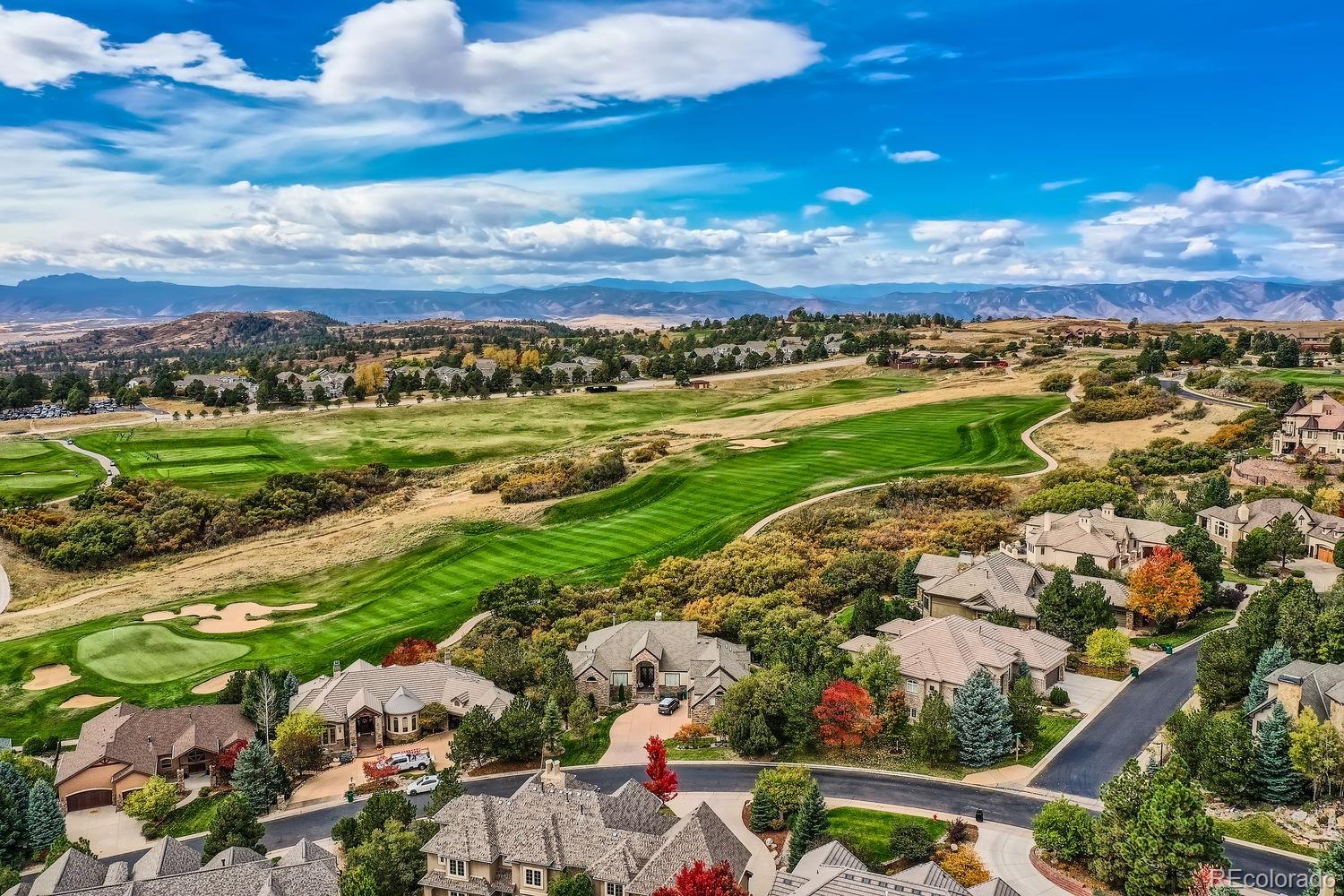 1050 Buffalo Ridge Road Castle Pines, CO 80108 - Photo 2 of 50 a view of a city with mountains in the background