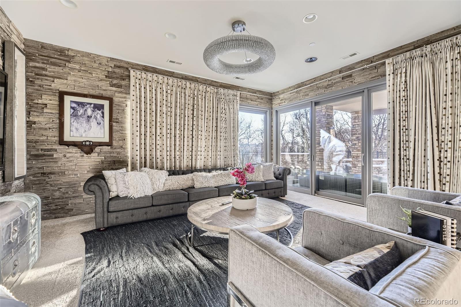 1050 Buffalo Ridge Road Castle Pines, CO 80108 - Photo 33 of 50 a living room with furniture and a large window