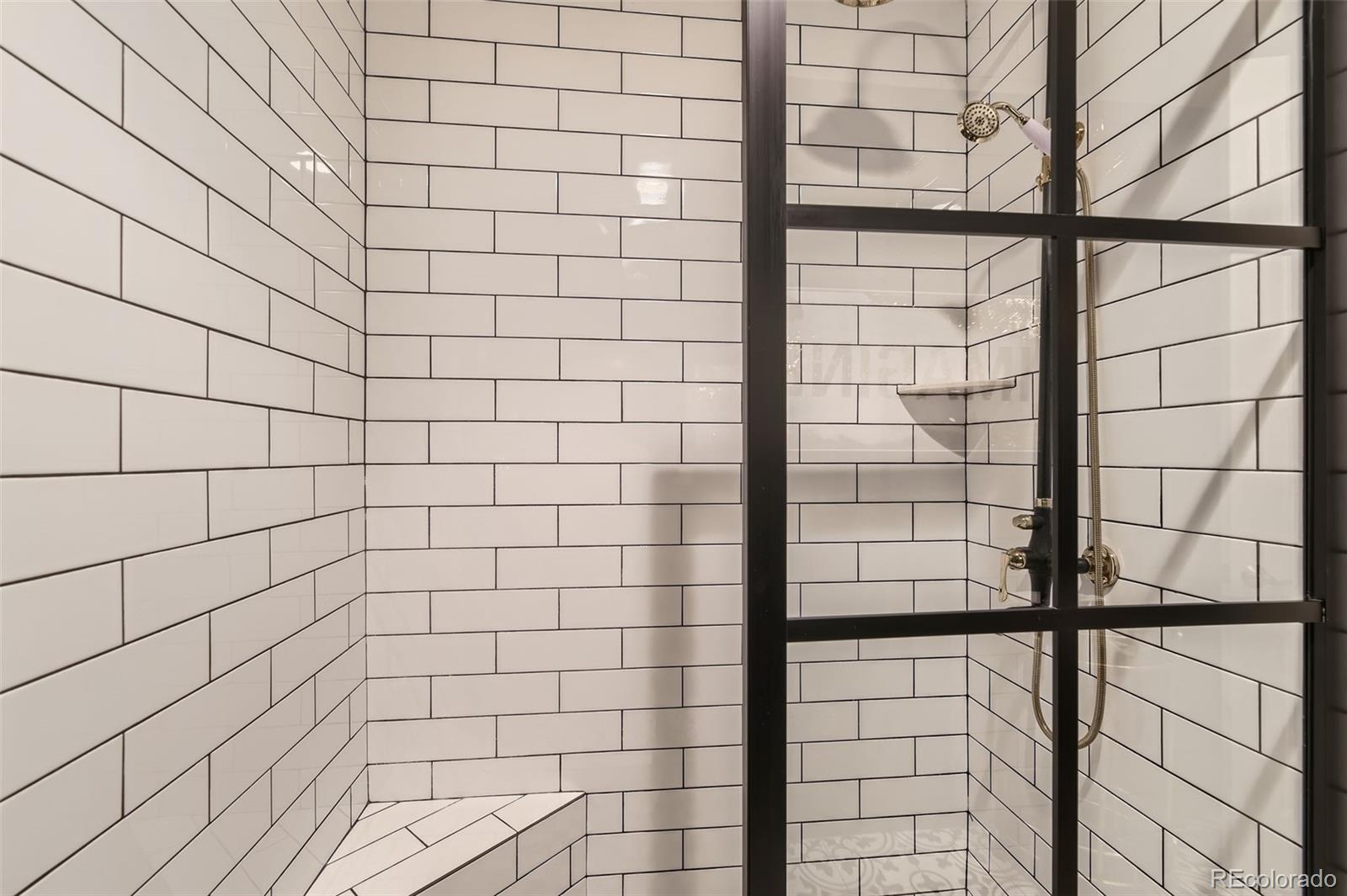 1050 Buffalo Ridge Road Castle Pines, CO 80108 - Photo 35 of 50 a bathroom with a shower