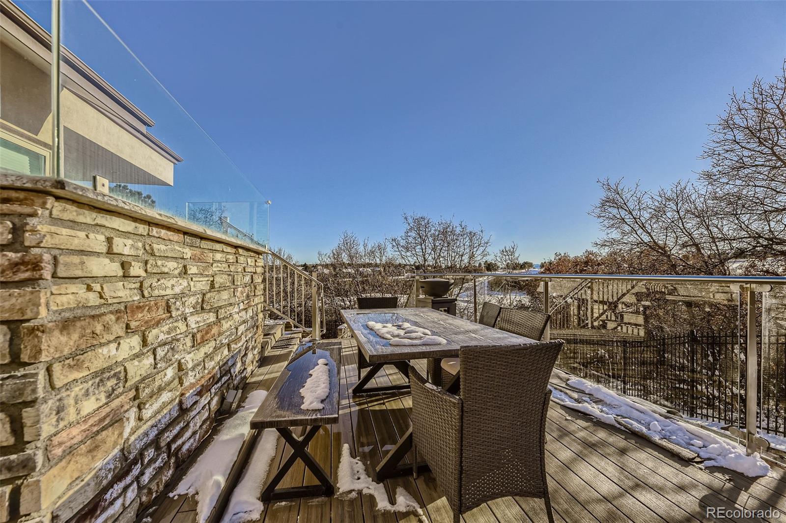 1050 Buffalo Ridge Road Castle Pines, CO 80108 - Photo 47 of 50 a view of a balcony with furniture and city view