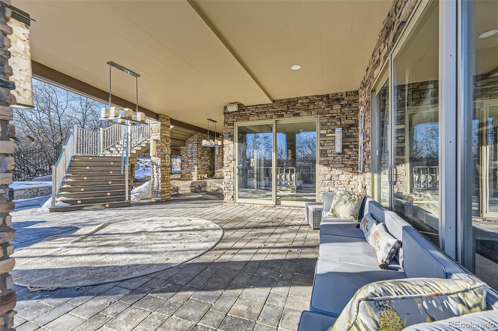 1050 Buffalo Ridge Road Castle Pines, CO 80108 - Photo 49 of 50 a view of living room with furniture and a rug