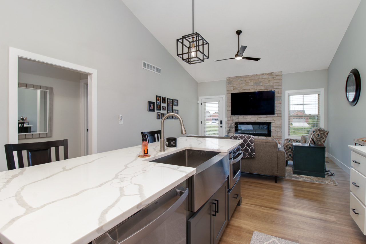 1903 Glenbridge Road Bloomington, IL 61704 - Photo 13 of 33 a kitchen with a center island and stainless steel appliances