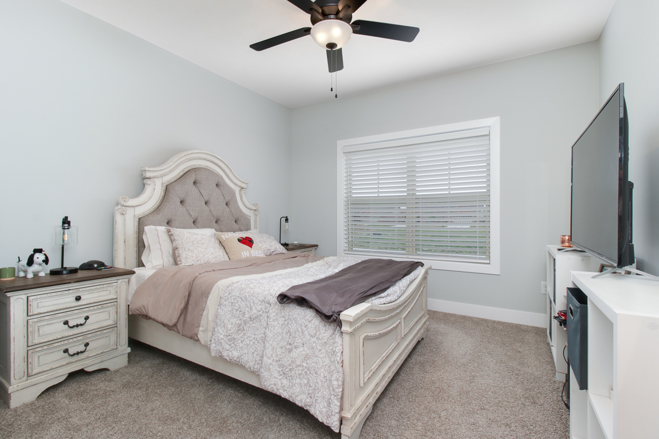1903 Glenbridge Road Bloomington, IL 61704 - Photo 16 of 33 a bedroom with a bed and a flat tv screen on the dresser