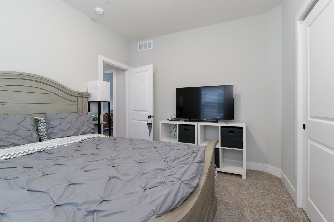 1903 Glenbridge Road Bloomington, IL 61704 - Photo 17 of 33 a bedroom with a bed and a flat screen tv