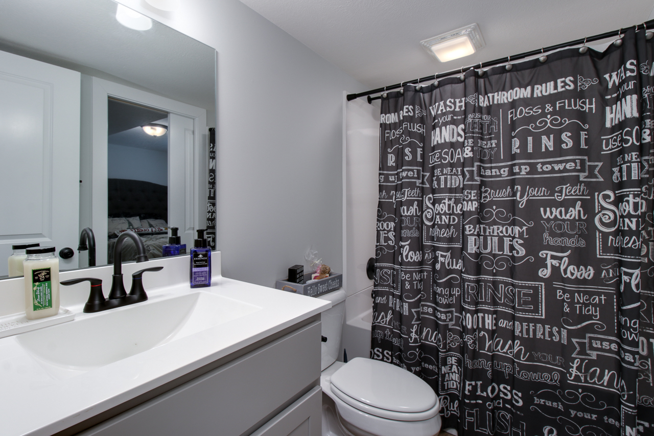 1903 Glenbridge Road Bloomington, IL 61704 - Photo 25 of 33 a bathroom with a sink a toilet and shower
