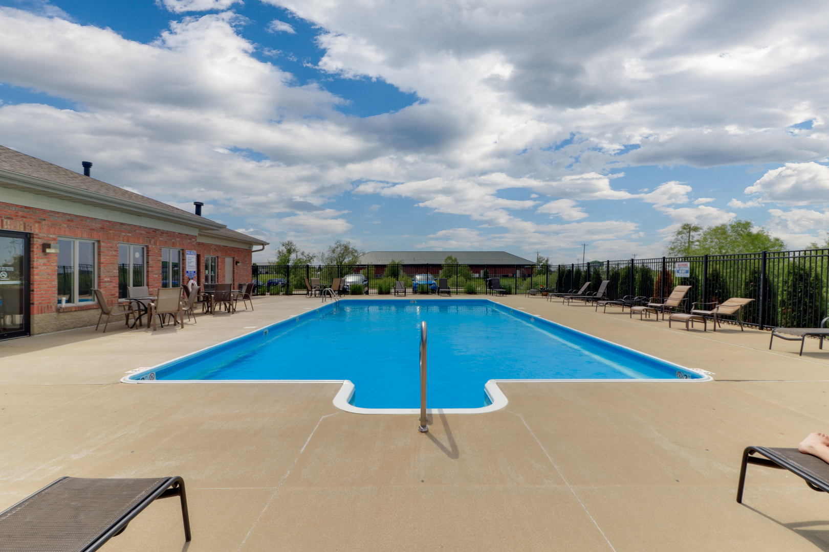 1903 Glenbridge Road Bloomington, IL 61704 - Photo 32 of 33 a view of swimming pool with seating space and barbeque in the background