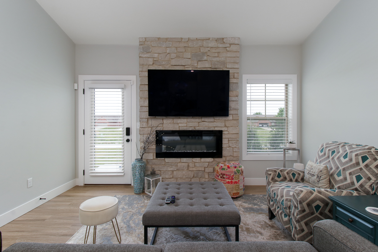 1903 Glenbridge Road Bloomington, IL 61704 - Photo 8 of 33 a living room with furniture and a fireplace
