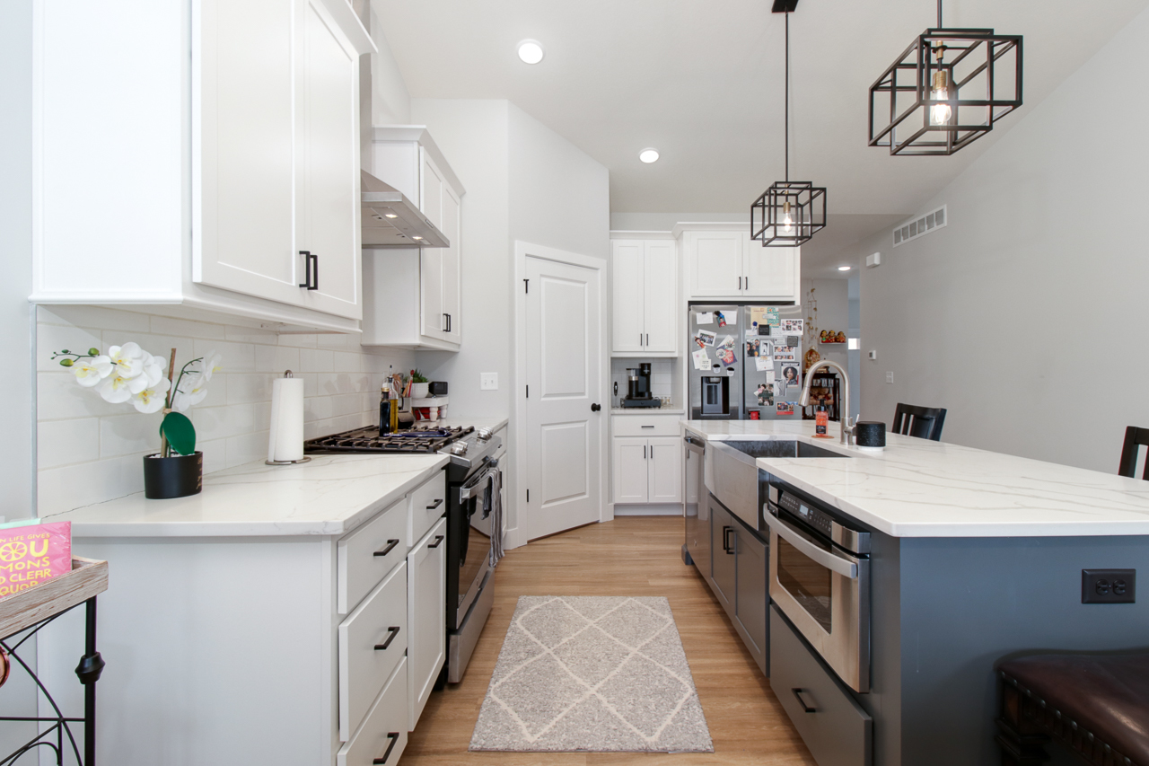 1903 Glenbridge Road Bloomington, IL 61704 - Photo 10 of 33 a kitchen that has a lot of cabinets and wooden floor