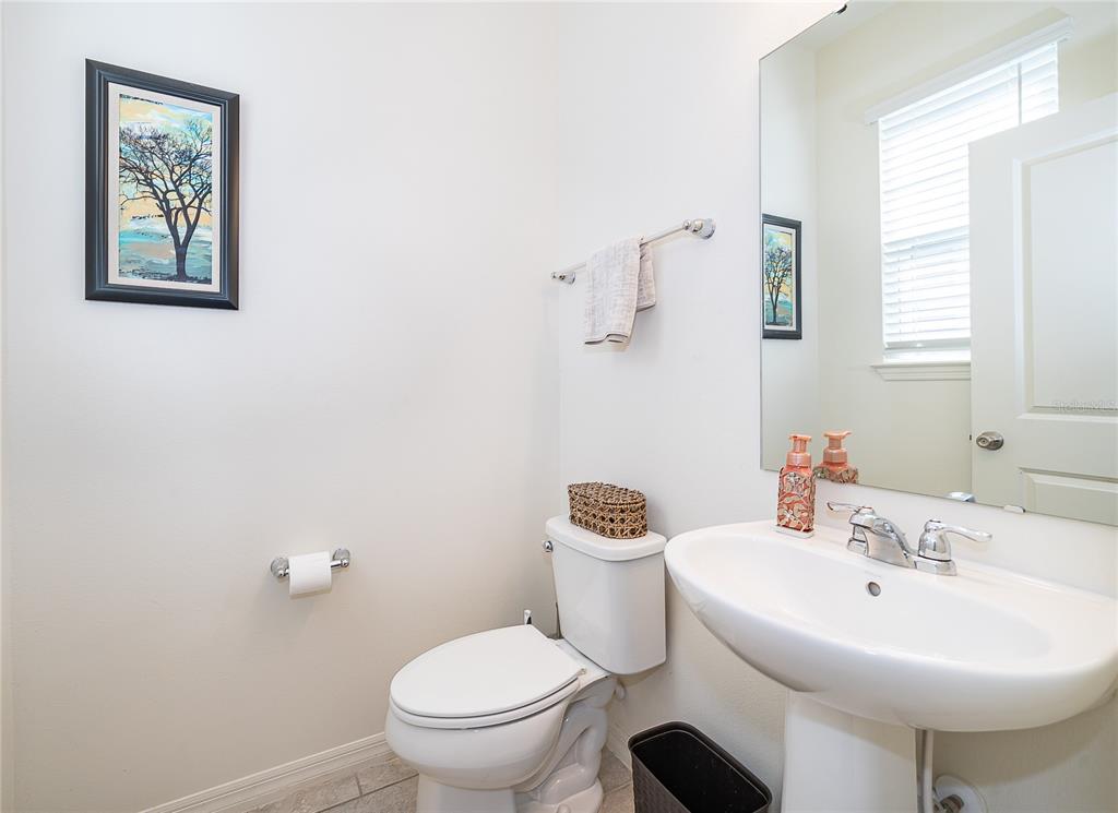 5849 Soter Lane Windermere, FL 34786 - Photo 13 of 31 a bathroom with a sink toilet and a mirror