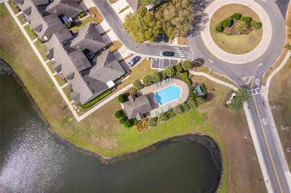 an aerial view of a house with a swimming pool