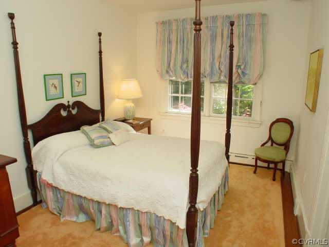 10 Robin Road Richmond, VA 23226 - Photo 8 of 10 a bedroom with a bed and a chandelier