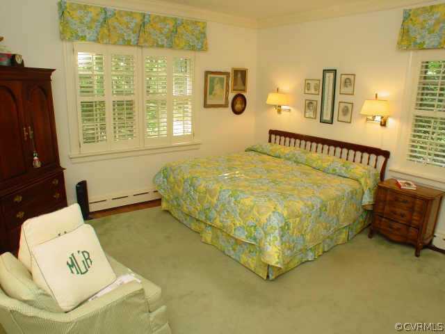 10 Robin Road Richmond, VA 23226 - Photo 9 of 10 a bed sitting in a bedroom next to a window