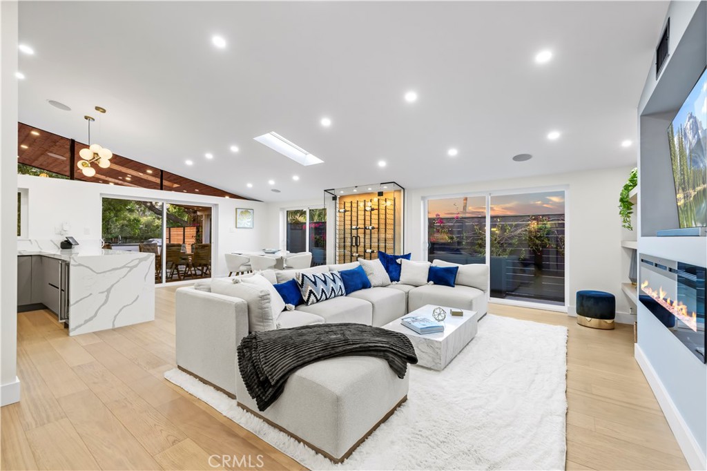 22263 Flanco Road Woodland Hills, CA 91364 - Photo 13 of 69 a living room with furniture and a large window