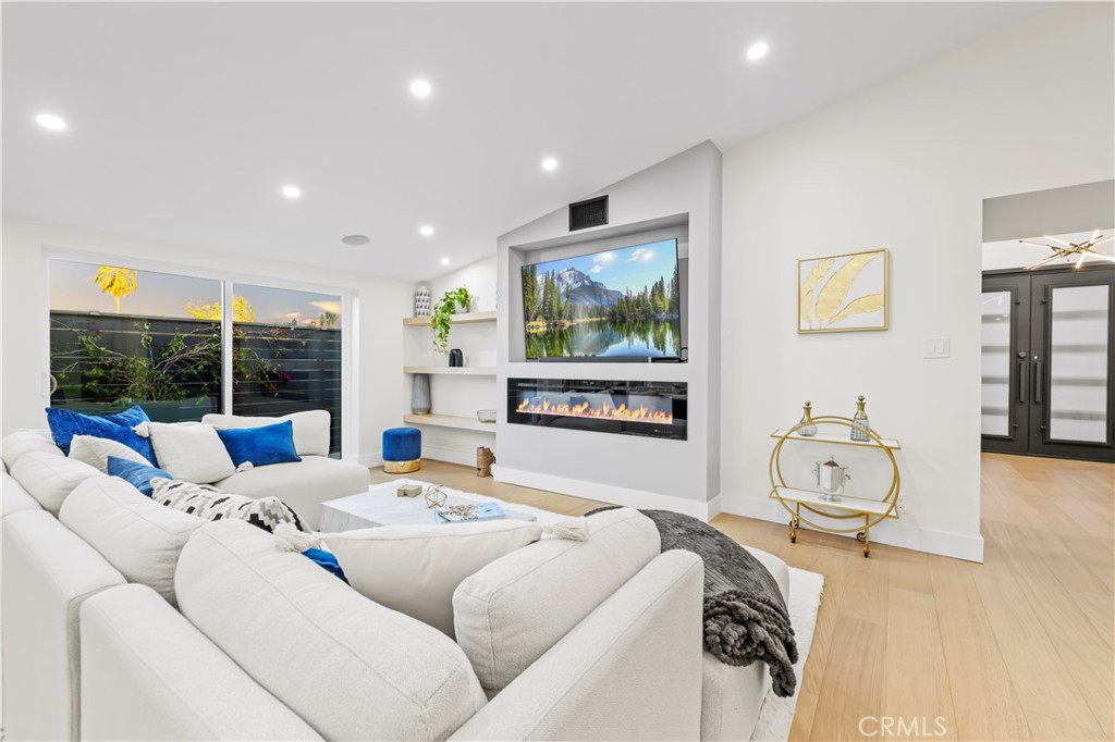 22263 Flanco Road Woodland Hills, CA 91364 - Photo 14 of 69 a living room with furniture and a flat screen tv