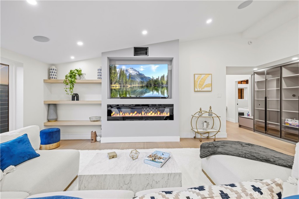 22263 Flanco Road Woodland Hills, CA 91364 - Photo 15 of 69 a living room with furniture and a flat screen tv