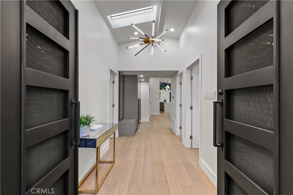 22263 Flanco Road Woodland Hills, CA 91364 - Photo 2 of 69 a view of a hallway view with wooden floor and staircase