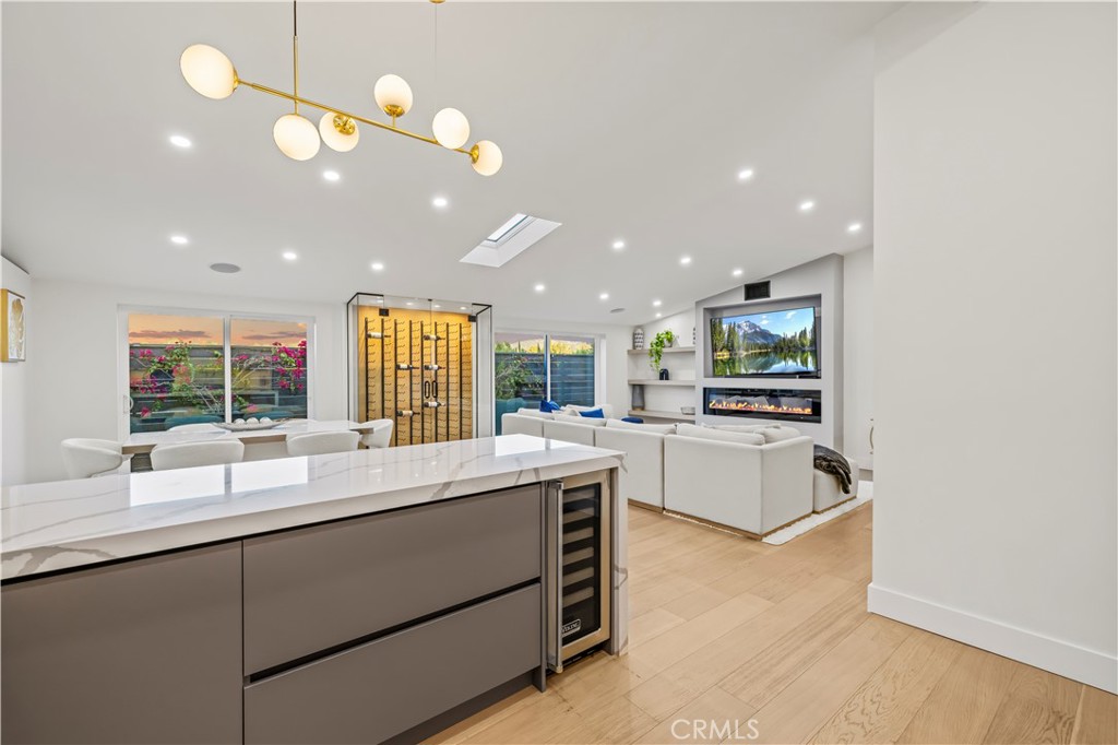 22263 Flanco Road Woodland Hills, CA 91364 - Photo 22 of 69 a large white kitchen with a large window appliances and cabinets