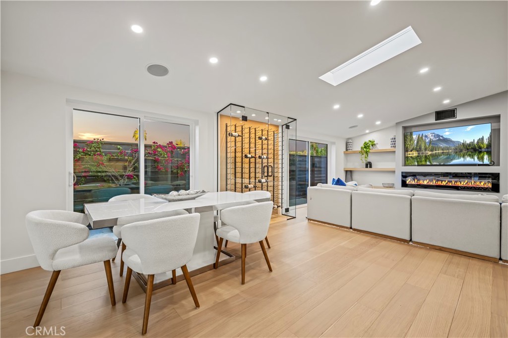 22263 Flanco Road Woodland Hills, CA 91364 - Photo 26 of 69 a view of a dining room with furniture window and wooden floor