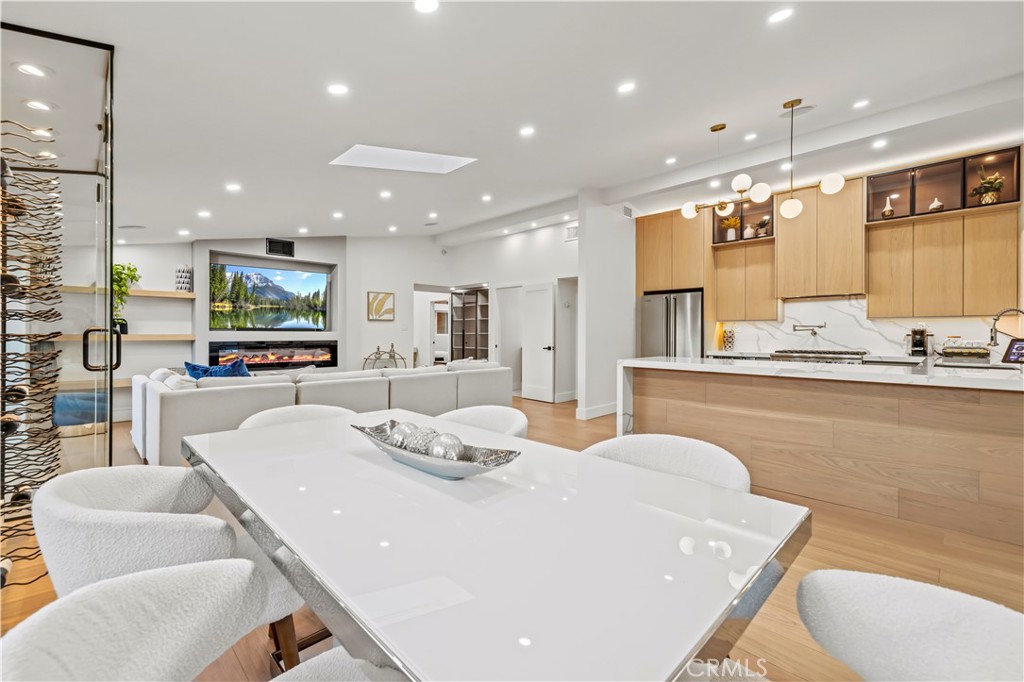 22263 Flanco Road Woodland Hills, CA 91364 - Photo 27 of 69 a large kitchen with a table and chairs