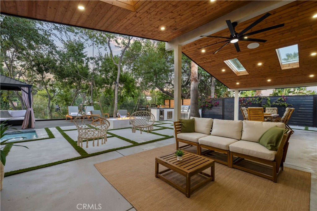 22263 Flanco Road Woodland Hills, CA 91364 - Photo 28 of 69 a outdoor living space with patio furniture and a potted plant