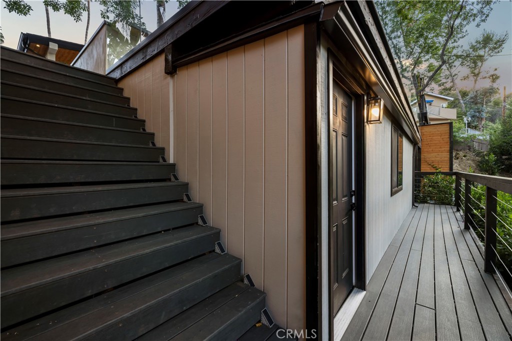 22263 Flanco Road Woodland Hills, CA 91364 - Photo 33 of 69 a view of backyard with wooden floor and outdoor seating