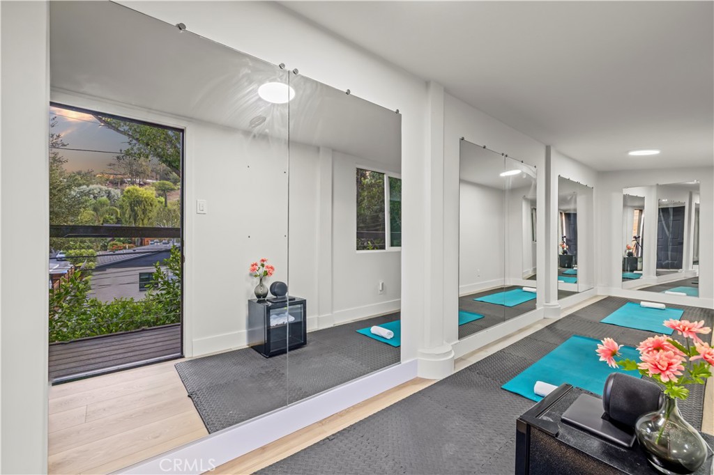 22263 Flanco Road Woodland Hills, CA 91364 - Photo 34 of 69 a living room with furniture and a flat screen tv