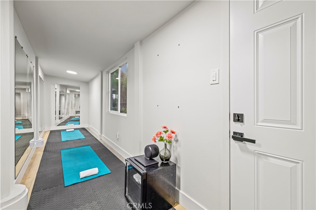 22263 Flanco Road Woodland Hills, CA 91364 - Photo 35 of 69 a living room with furniture and a rug