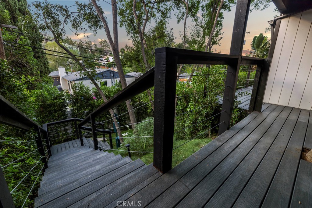 22263 Flanco Road Woodland Hills, CA 91364 - Photo 37 of 69 a view of deck with wooden floor and outdoor seating