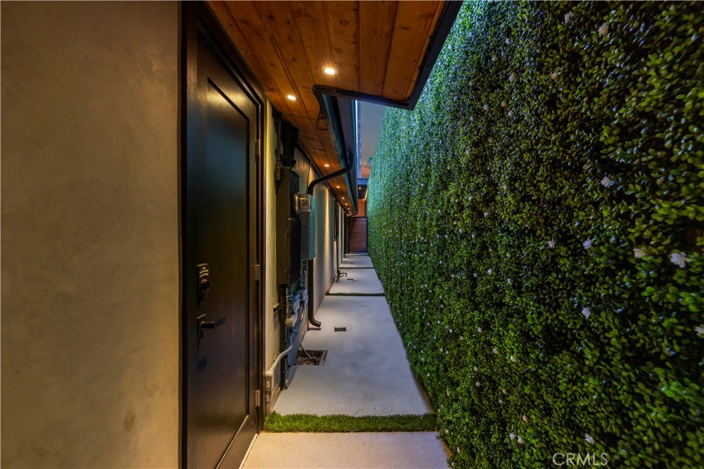 22263 Flanco Road Woodland Hills, CA 91364 - Photo 40 of 69 a view of a pathway both side of house