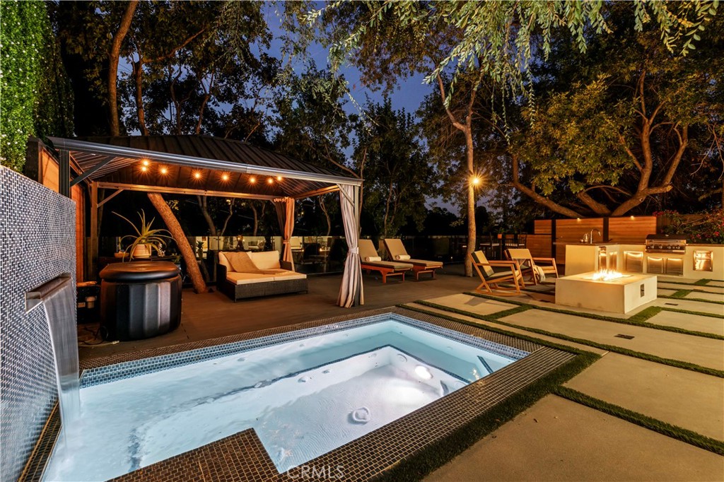 22263 Flanco Road Woodland Hills, CA 91364 - Photo 49 of 69 a view of swimming pool with chairs and large trees