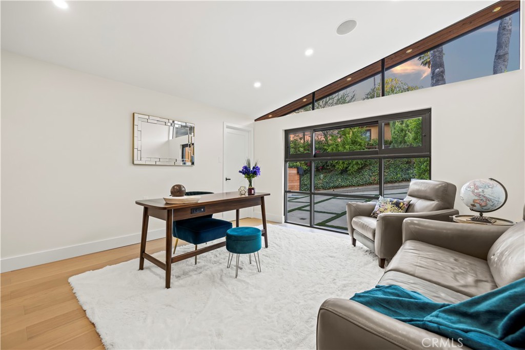 22263 Flanco Road Woodland Hills, CA 91364 - Photo 5 of 69 a living room with furniture and a window