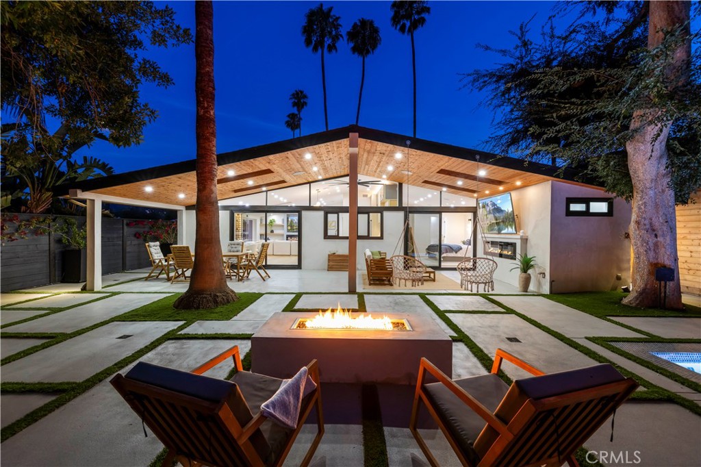 22263 Flanco Road Woodland Hills, CA 91364 - Photo 54 of 69 a outdoor sitting area with furniture and wooden floor