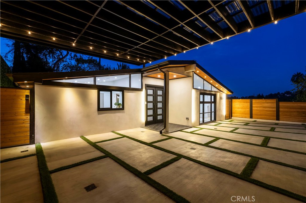 22263 Flanco Road Woodland Hills, CA 91364 - Photo 57 of 69 a bed room with a bed and a large window