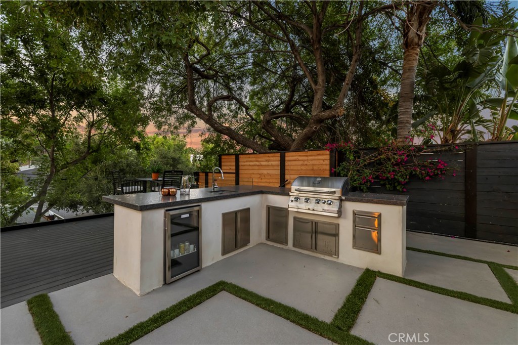 22263 Flanco Road Woodland Hills, CA 91364 - Photo 63 of 69 a view of a kitchen with a stove