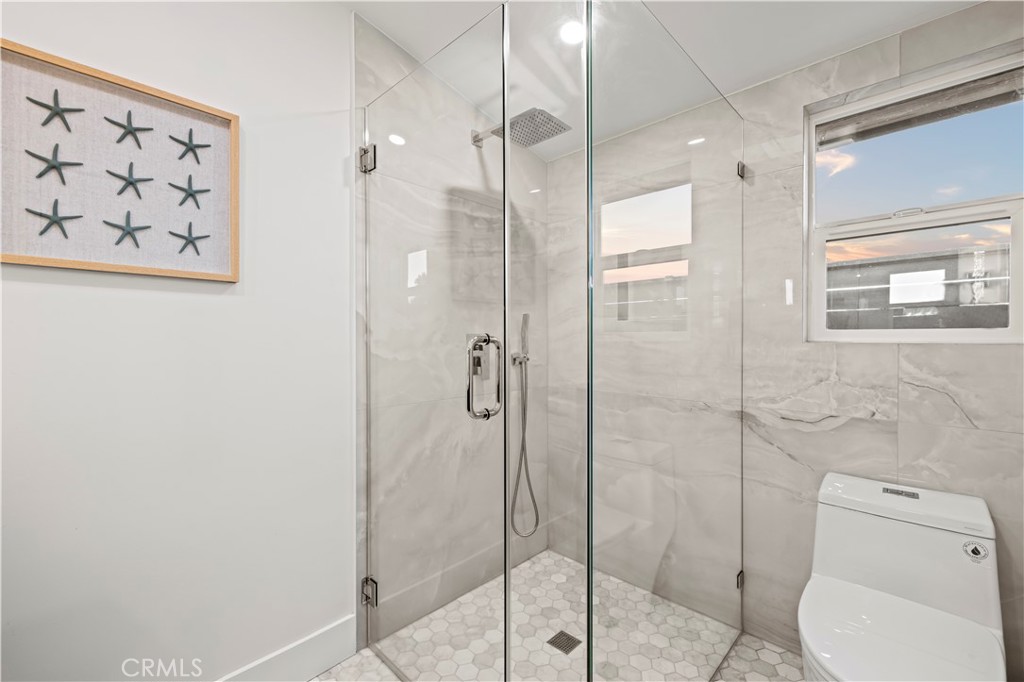 22263 Flanco Road Woodland Hills, CA 91364 - Photo 8 of 69 a bathroom with a toilet and a shower