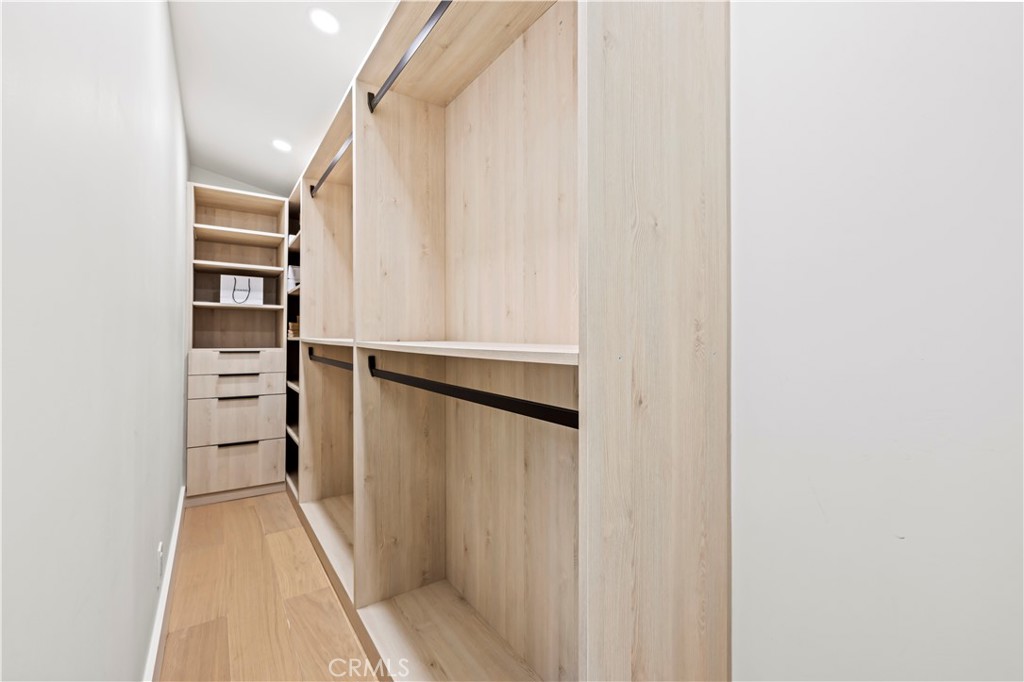 22263 Flanco Road Woodland Hills, CA 91364 - Photo 10 of 69 a view of walk in closet with empty racks