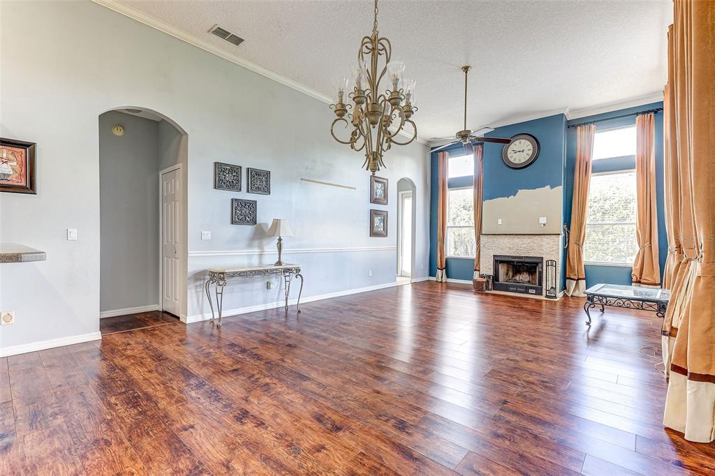 918 Algare Loop Windermere, FL 34786 - Photo 18 of 73 a view of a livingroom with furniture window wooden floor and a fireplace