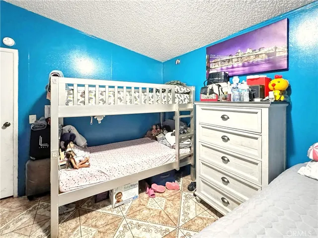 a bed room with a bed and a bed