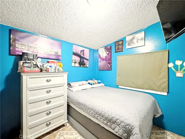 a bedroom with a bed and furniture