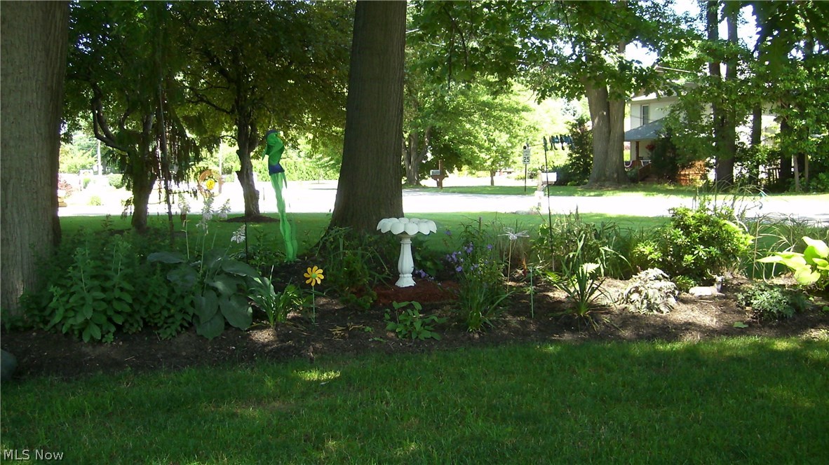 8087 Munson Road Mentor, OH 44060 - Photo 22 of 23 Beautiful landscaping surrounds the home.