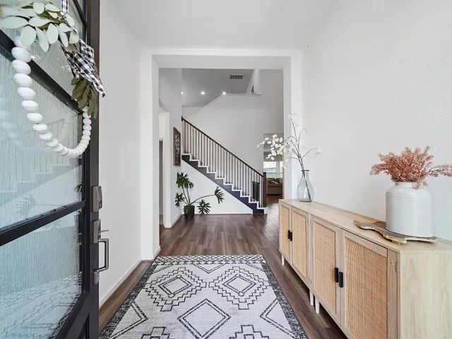 a view of entryway with wooden floor