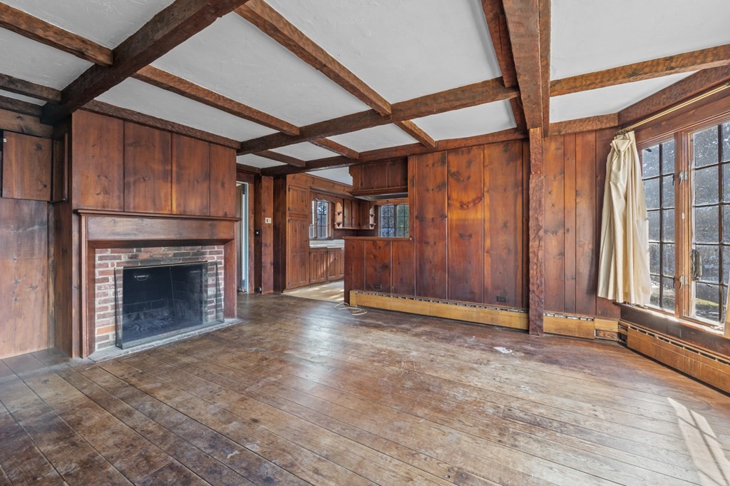 97 Beach Bluff Avenue Swampscott, MA 01907 - Photo 17 of 36 a view of an empty room with a fireplace and a window