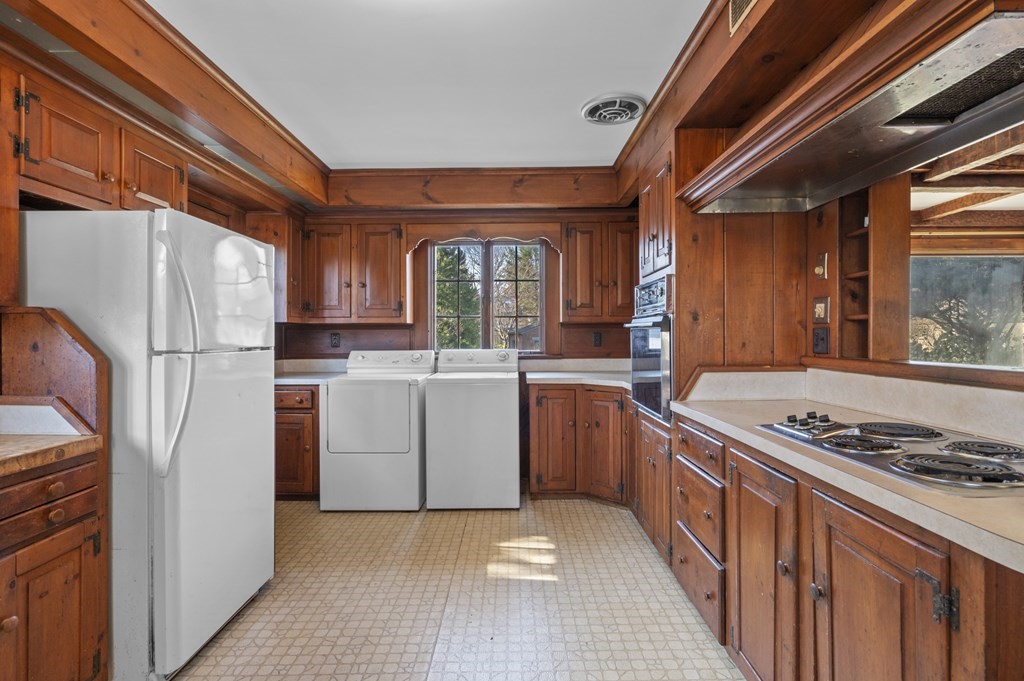 97 Beach Bluff Avenue Swampscott, MA 01907 - Photo 20 of 36 a kitchen with a stove a sink dishwasher a refrigerator and a stove
