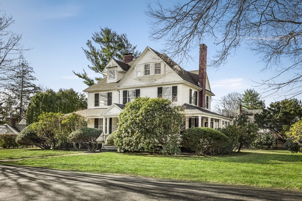 97 Beach Bluff Avenue Swampscott, MA 01907 - Photo 2 of 36 a front view of a house with a yard