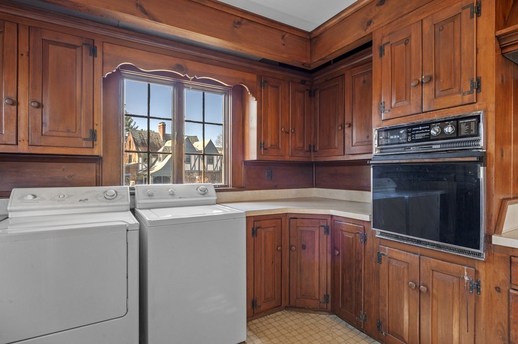 97 Beach Bluff Avenue Swampscott, MA 01907 - Photo 21 of 36 a kitchen with stainless steel appliances granite countertop a refrigerator and cabinets
